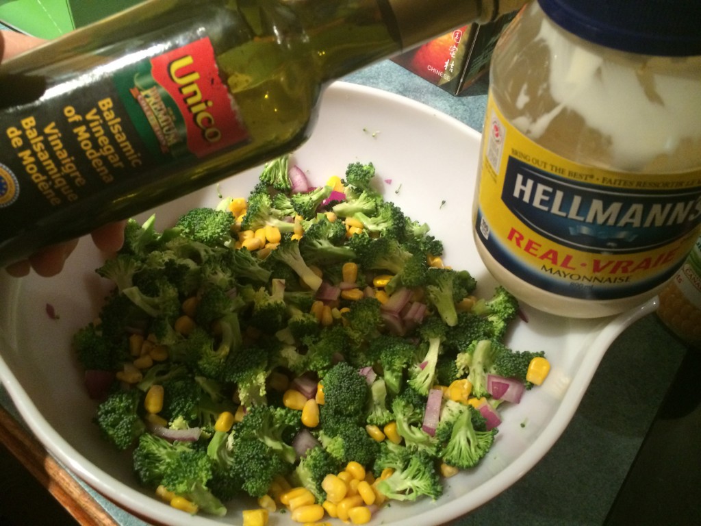 adding dressing to salad