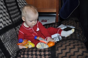 baby opens christmas stocking