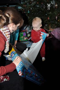 baby opening christmas present