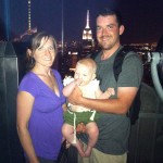 family in front of empire state building