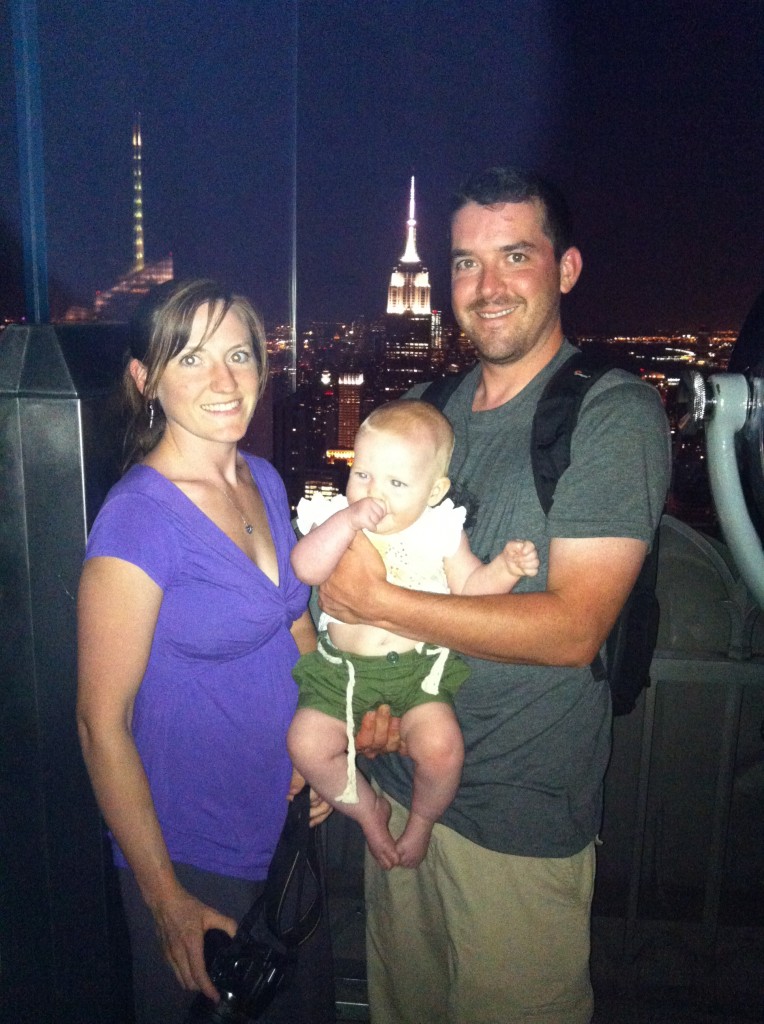 family in front of empire state building