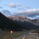 driving through the rockies at sunrise