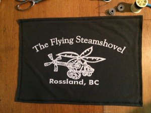 Flying steamshovel tshirt logo