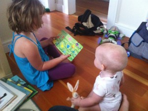 child reading to baby