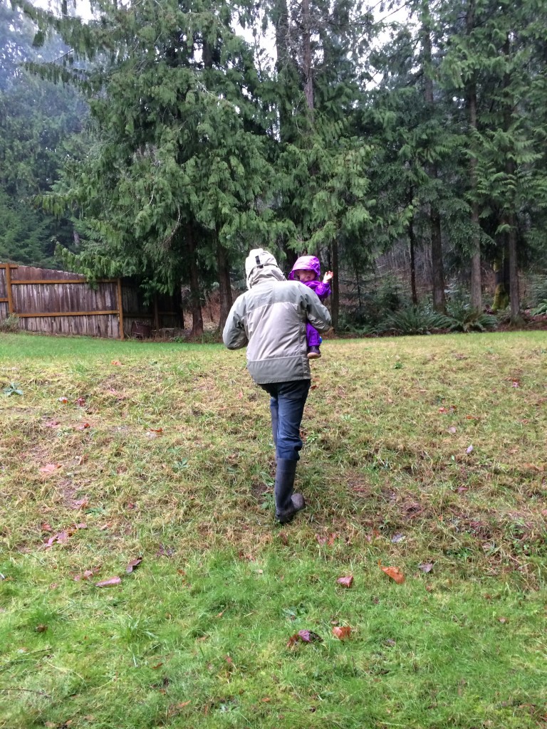 dad and toddler outside in rain