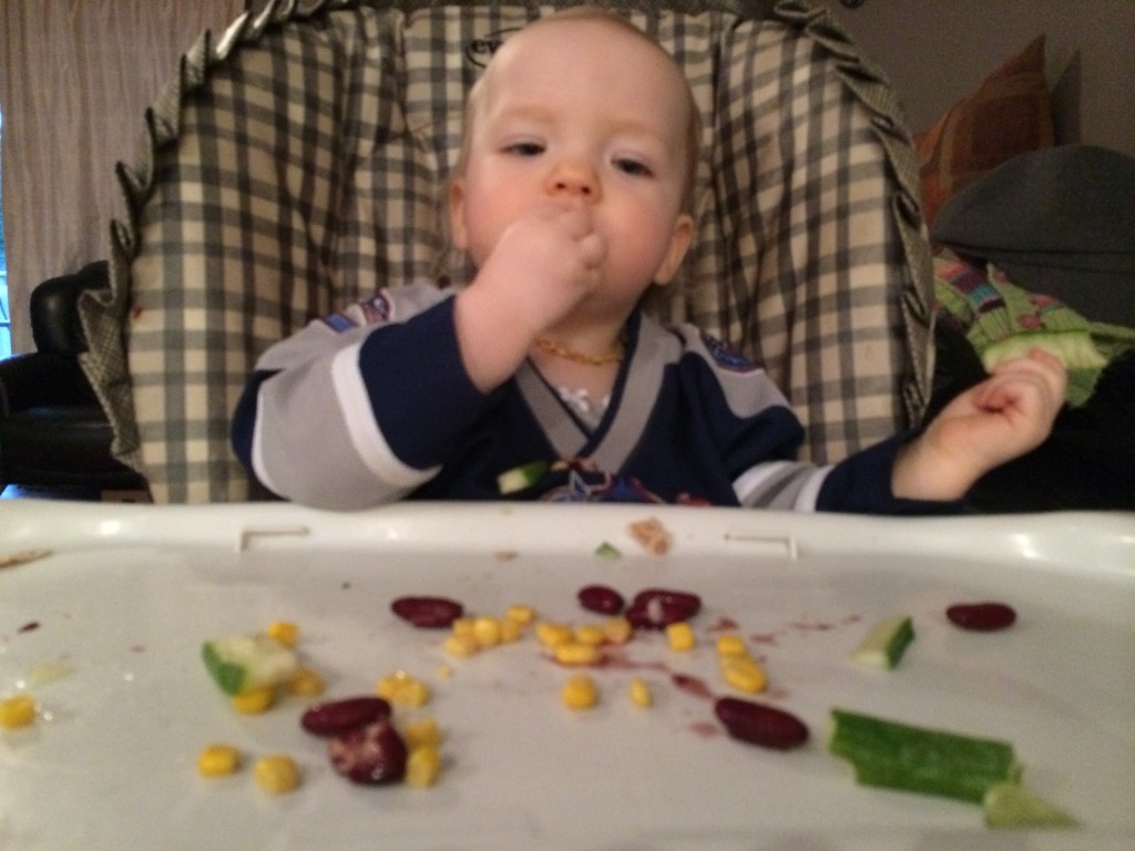 baby eating tortilla pie filling