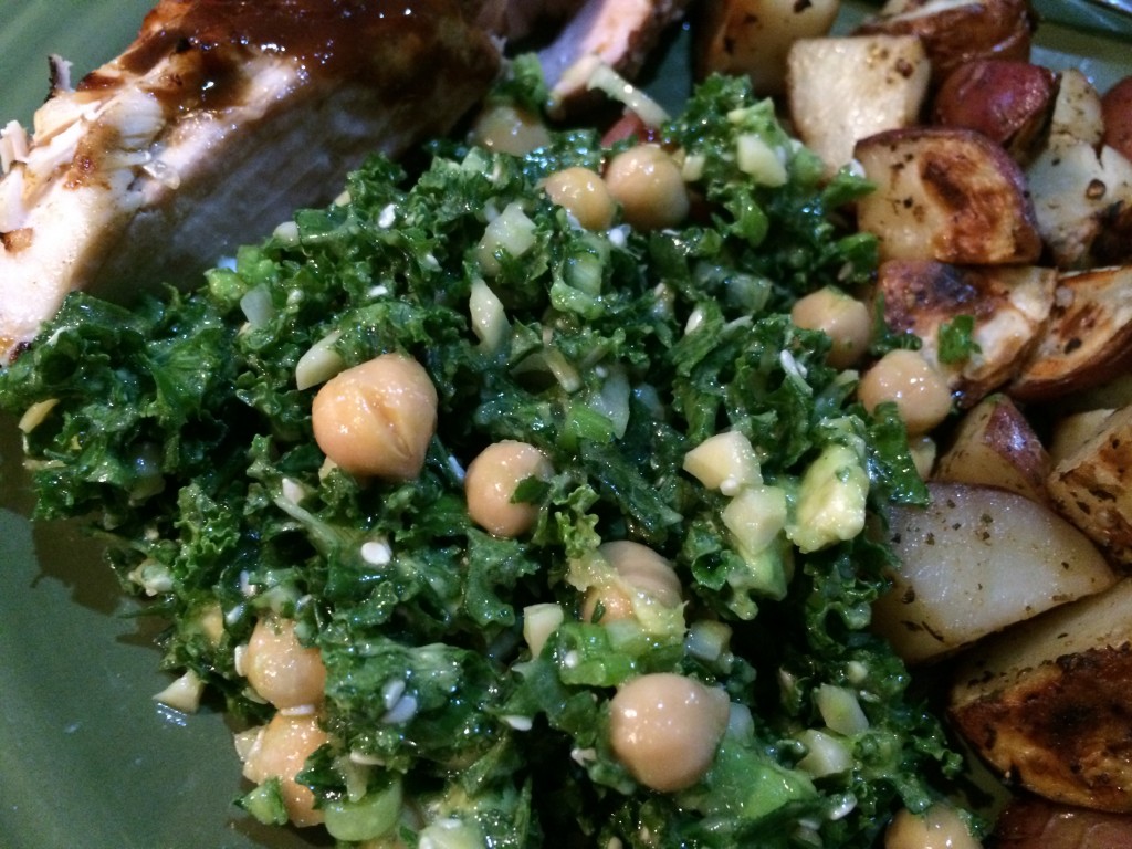 Kale salad with almonds, sesame seeds, ginger and chickpeas