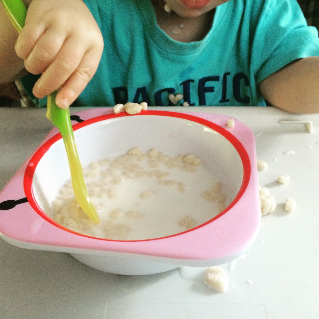 21 months old toddler eating cereal