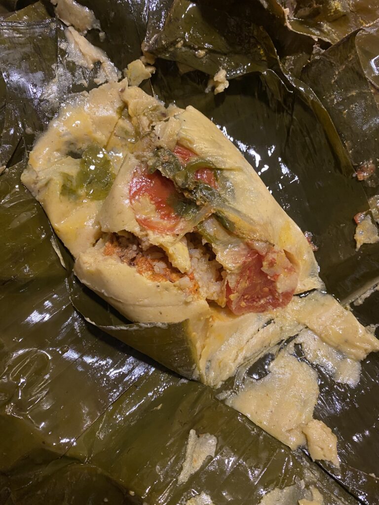 Nacatamale, a traditional Nicaraguan dish of corn meal, chicken and spices served wrapped in a banana leaf